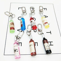 Aveuri Simple Funny Imitation Wine Bottle Keychain Fashion Tiny Earphone Cover Pendant Bag Accessory Key Chain Best Friend Gift Jewelry