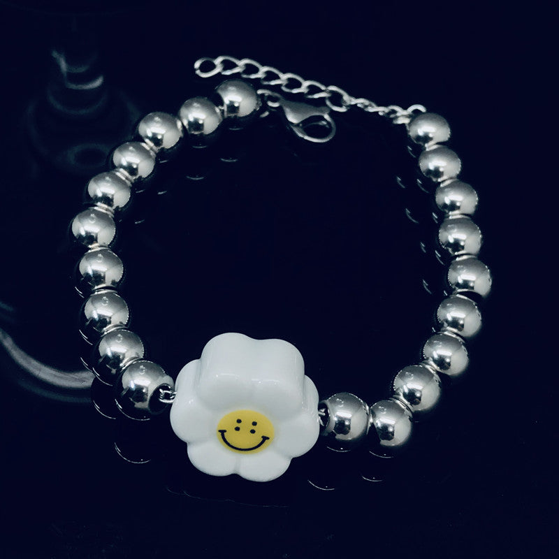 Origin goods supply Xin steel national tide daisy laughs face beads couple men and women titanium steel section Yi En with steel bead bracelet